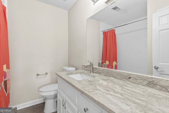 1645 Oakfield Ln, Roswell, GA 30075 - bathroom featuring vanity, toilet, wood finished floors, baseboards, and a shower with curtain