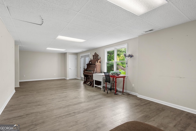 1645 Oakfield Ln, Roswell, GA 30075 - living area featuring baseboards, wood finished floors, and a drop ceiling