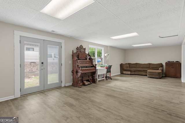 1645 Oakfield Ln, Roswell, GA 30075 - living area with french doors, wood finished floors, and baseboards