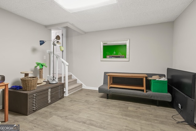 1645 Oakfield Ln, Roswell, GA 30075 - sitting room with wood finished floors, a drop ceiling, and stairway
