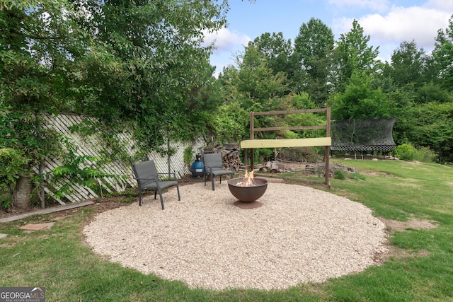 1645 Oakfield Ln, Roswell, GA 30075 - view of patio / terrace with a fire pit