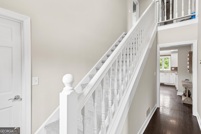 1645 Oakfield Ln, Roswell, GA 30075 - stairs with wood finished floors and baseboards