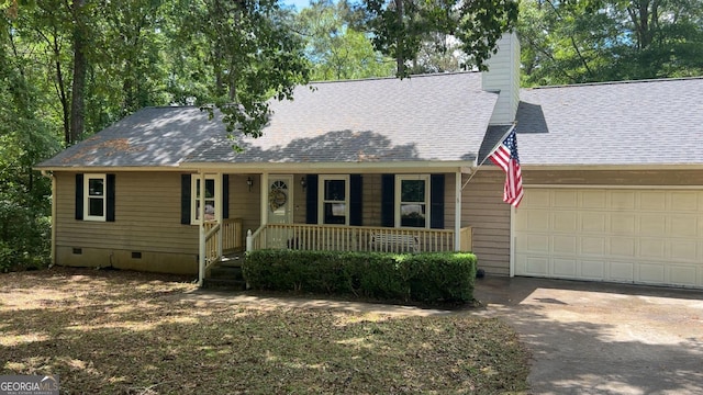 1751 Brindle Ln, Macon, GA 31220 - view of front facade featuring covered porch, an attached garage, driveway, a chimney, and crawl space