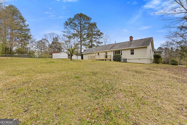 1312 Milstead Ave NE, Conyers, GA 30012 - back of property featuring a chimney