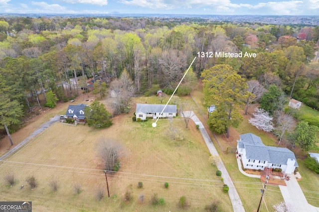 1312 Milstead Ave NE, Conyers, GA 30012 - view from above of property featuring a forest