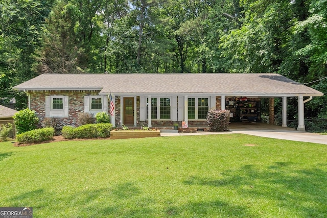 4371 N Park Dr, Tucker, GA 30084 - ranch-style house featuring concrete driveway, a front yard, roof with shingles, and an attached carport