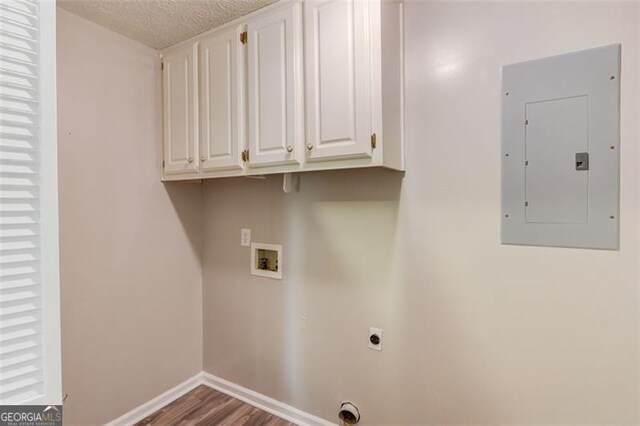 1980 Mcconnell, Grayson, GA 30017 - laundry area with electric panel, hookup for an electric dryer, washer hookup, cabinet space, and wood finished floors