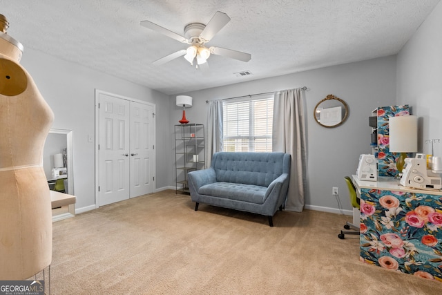 2009 Parador Aly, Mcdonough, GA 30253 - sitting room featuring carpet, a ceiling fan, baseboards, and a textured ceiling