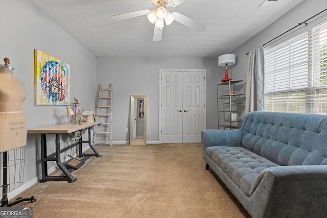 2009 Parador Aly, Mcdonough, GA 30253 - sitting room with light colored carpet, a ceiling fan, baseboards, and a textured ceiling