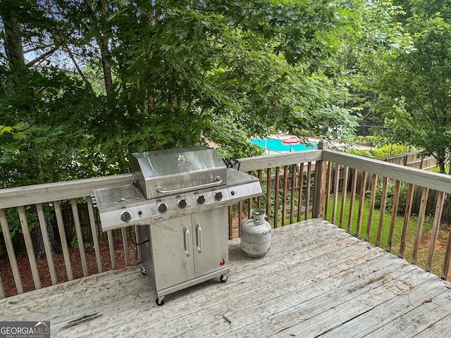 2009 Parador Aly, Mcdonough, GA 30253 - wooden deck with grilling area and a fenced backyard