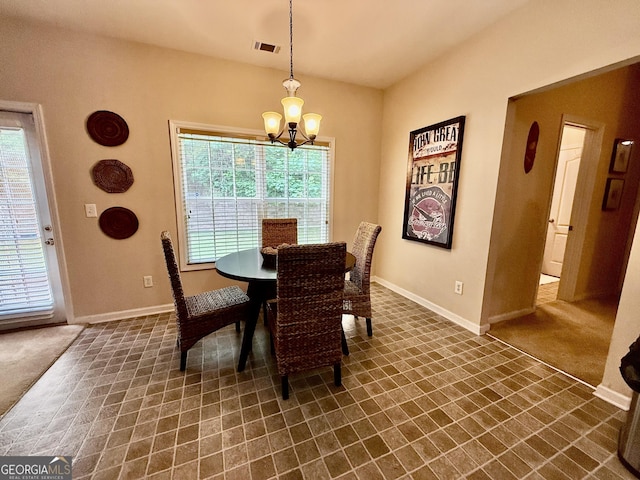 3205 Anneewakee Falls Parkway, Douglasville, GA 30135 - dining space with a chandelier, plenty of natural light, and dark colored carpet