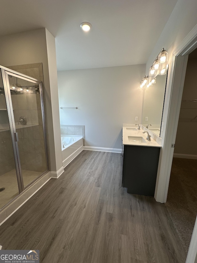 5000 Fairview Cir, Villa Rica, GA 30180 - full bath featuring double vanity, wood finished floors, a stall shower, and a bath