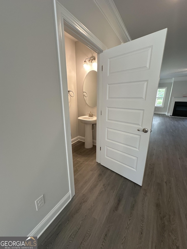 5000 Fairview Cir, Villa Rica, GA 30180 - hallway with baseboards, dark wood-type flooring, a sink, and ornamental molding