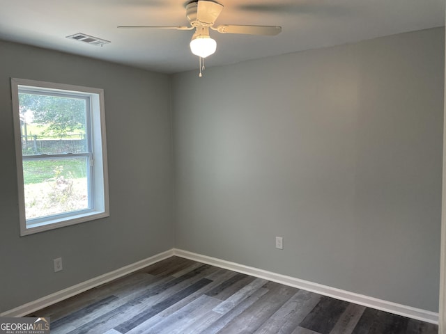 3433 Sandra Fay Dr, Macon, GA 31206 - spare room featuring baseboards, dark wood-style floors, and a ceiling fan