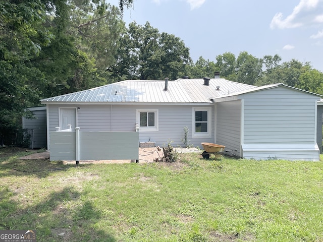 3433 Sandra Fay Dr, Macon, GA 31206 - back of property with a yard and metal roof