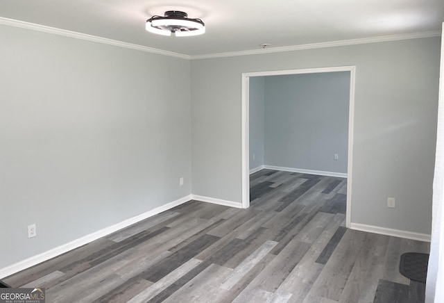 3433 Sandra Fay Dr, Macon, GA 31206 - unfurnished room with dark wood-style floors, baseboards, crown molding, and a pendent fire sprinkler