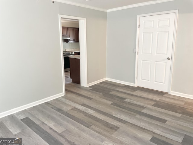 3433 Sandra Fay Dr, Macon, GA 31206 - spare room with ornamental molding, baseboards, and wood finished floors
