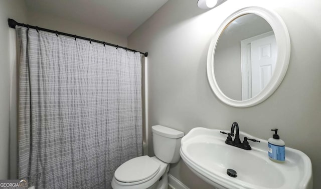 180 Mountain Path, Rockmart, GA 30153 - bathroom featuring a sink, toilet, and curtained shower