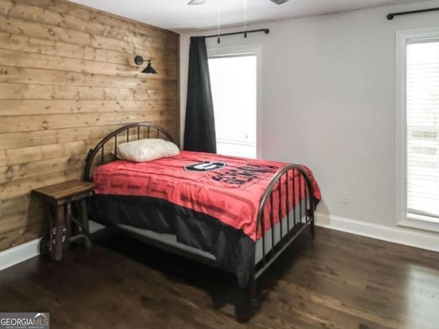 180 Mountain Path, Rockmart, GA 30153 - bedroom with wooden walls, baseboards, wood finished floors, and ceiling fan