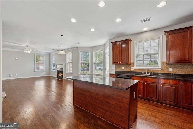 3134 Flery Way, Lawrenceville, GA 30046 - kitchen featuring a sink, recessed lighting, tasteful backsplash, black dishwasher, and a lit fireplace