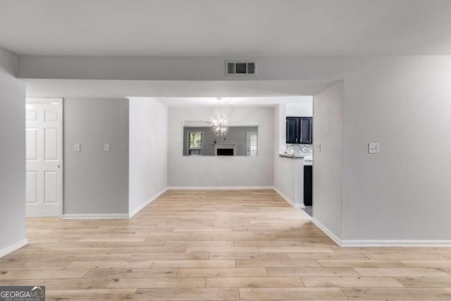 2135 N Forest Trl, Atlanta, GA 30338 - spare room with light wood-type flooring and a chandelier