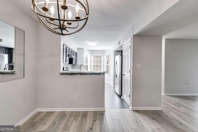 2135 N Forest Trl, Atlanta, GA 30338 - unfurnished dining area with a chandelier and wood finished floors