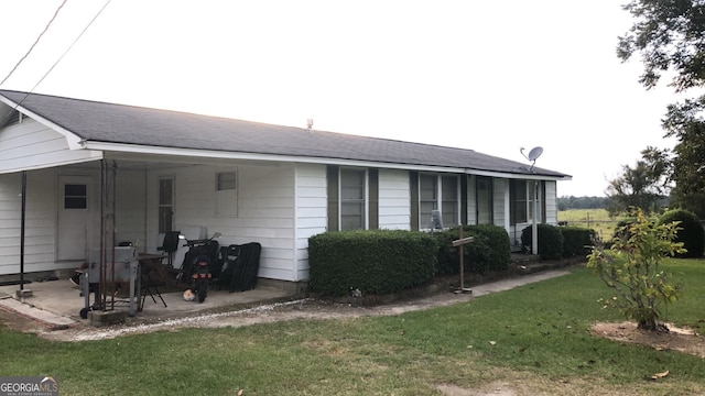 1963 Antioch Church Rd, Eastman, GA 31023 - view of side of property featuring a lawn and a patio