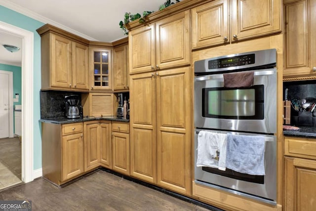 4845 Willow St, Acworth, GA 30101 - kitchen with double oven, backsplash, glass insert cabinets, ornamental molding, and dark wood-style flooring