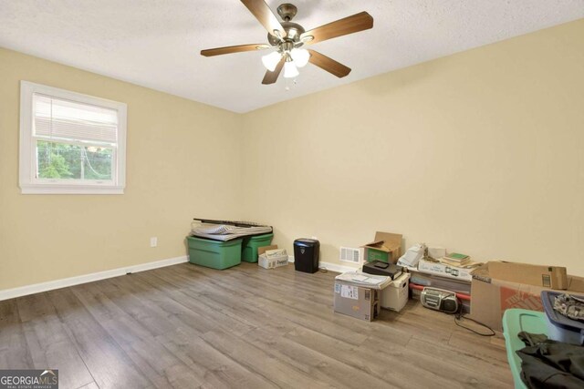 4845 Willow St, Acworth, GA 30101 - empty room with wood finished floors and a ceiling fan