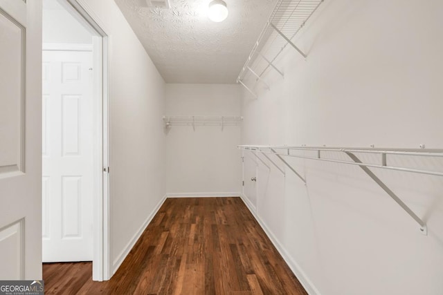 3338 Gardenside Walk, Loganville, GA 30052 - walk in closet with dark wood finished floors