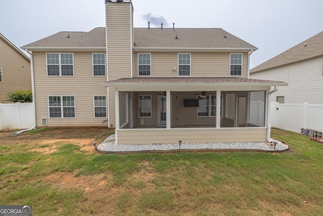 3338 Gardenside Walk, Loganville, GA 30052 - back of house featuring a sunroom, a chimney, and roof with shingles