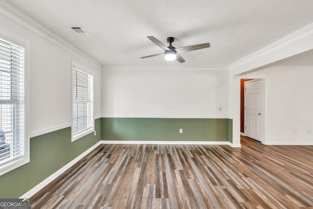 3338 Gardenside Walk, Loganville, GA 30052 - unfurnished room with wood finished floors, ceiling fan, and crown molding