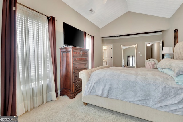 498 N Jeff Davis Dr, Fayetteville, GA 30214 - bedroom with light carpet, vaulted ceiling, and ensuite bathroom