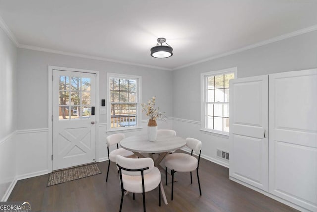 935 Old Loganville Rd, Loganville, GA 30052 - dining room with dark wood-type flooring and crown molding