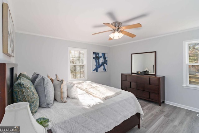 935 Old Loganville Rd, Loganville, GA 30052 - bedroom featuring light wood-type flooring, crown molding, and a ceiling fan