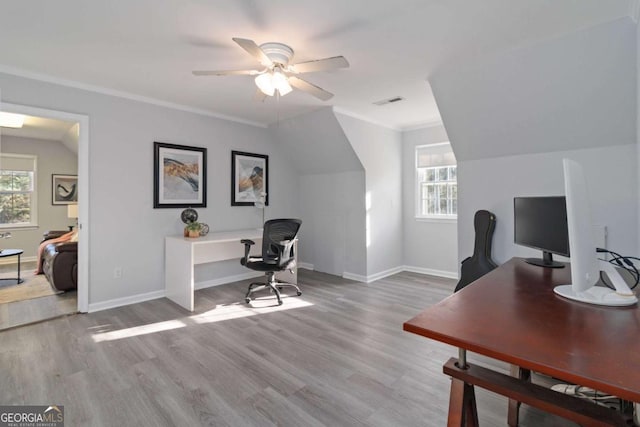935 Old Loganville Rd, Loganville, GA 30052 - home office with plenty of natural light, ceiling fan, wood finished floors, vaulted ceiling, and crown molding