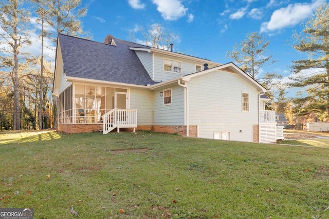 935 Old Loganville Rd, Loganville, GA 30052 - rear view of house featuring a sunroom, roof with shingles, and a lawn