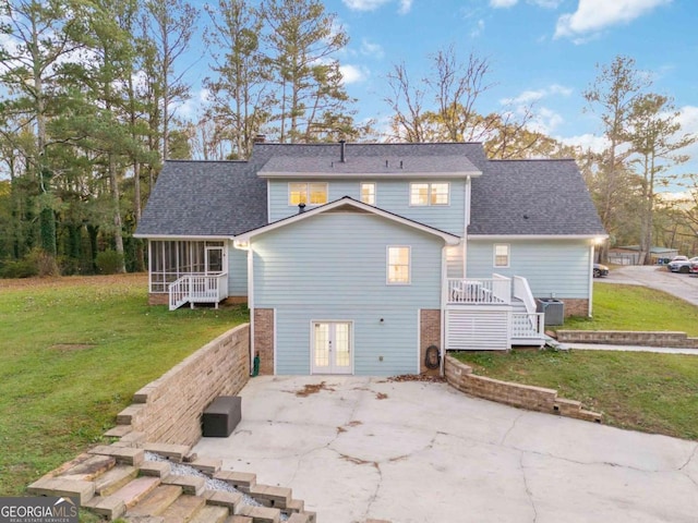 935 Old Loganville Rd, Loganville, GA 30052 - back of property featuring a patio, a deck, french doors, a sunroom, and a yard