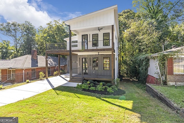 1464 Ezra Church Dr NW, Atlanta, GA 30314 - view of front of home with covered porch, a balcony, ceiling fan, french doors, and brick siding
