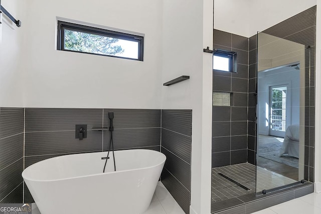 1464 Ezra Church Dr NW, Atlanta, GA 30314 - full bath featuring plenty of natural light, a freestanding bath, tile walls, and a shower stall