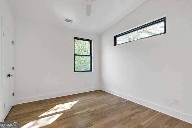 1464 Ezra Church Dr NW, Atlanta, GA 30314 - unfurnished room with ceiling fan, wood finished floors, and baseboards