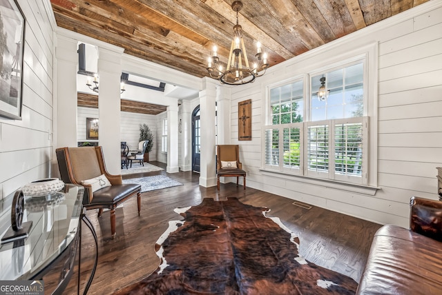 206 Savanna Estates Ct, Canton, GA 30115 - sitting room with ornate columns, wood ceiling, wood walls, wood finished floors, and a chandelier