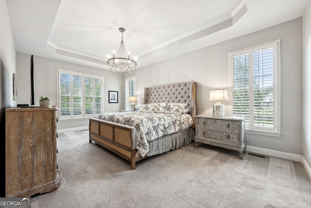 206 Savanna Estates Ct, Canton, GA 30115 - carpeted bedroom featuring a tray ceiling, multiple windows, a chandelier, and ornamental molding