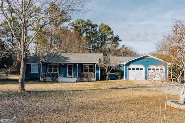 110 Fox Meadow Dr, Covington, GA 30016 - single story home featuring a porch, a front lawn, driveway, and a garage