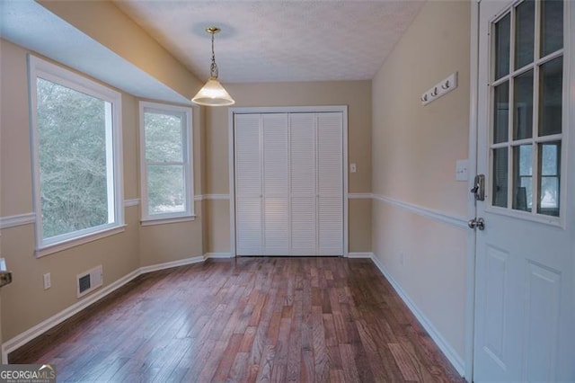 110 Fox Meadow Dr, Covington, GA 30016 - unfurnished dining area with dark wood finished floors and baseboards