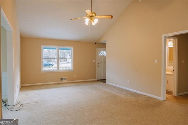 110 Fox Meadow Dr, Covington, GA 30016 - unfurnished room featuring light carpet, a ceiling fan, high vaulted ceiling, and baseboards