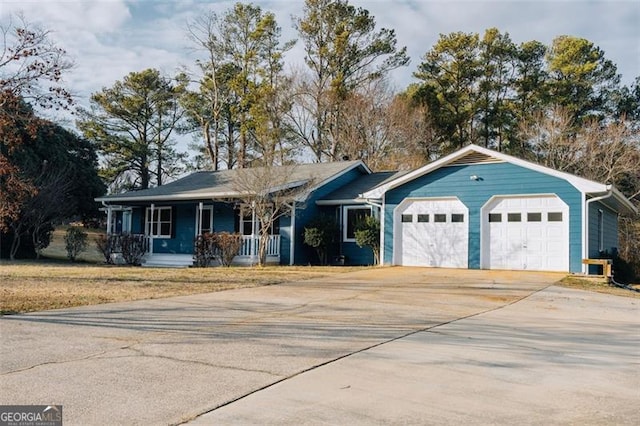 110 Fox Meadow Dr, Covington, GA 30016 - ranch-style home featuring a porch, a garage, and concrete driveway