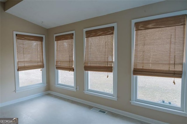 110 Fox Meadow Dr, Covington, GA 30016 - unfurnished sunroom with lofted ceiling and baseboards