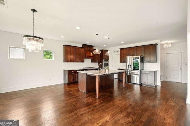 847 Rolling Hl, Kennesaw, GA 30152 - kitchen with appliances with stainless steel finishes, tasteful backsplash, a chandelier, a kitchen island with sink, and recessed lighting