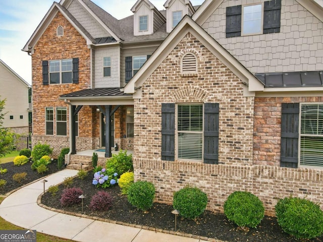 847 Rolling Hl, Kennesaw, GA 30152 - craftsman house featuring a standing seam roof, brick siding, metal roof, and covered porch